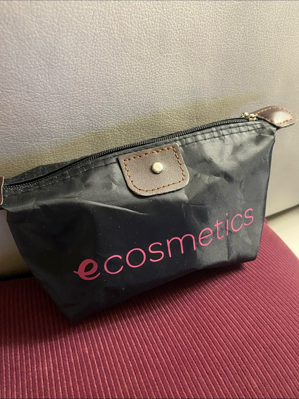EM Cosmetics Black Cosmetic Pouch with Pink Logo and Brown Trim